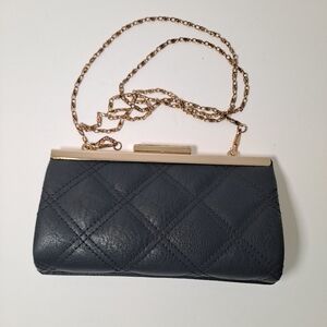 Elegant Black Quilted Clutch with Gold Chain.
